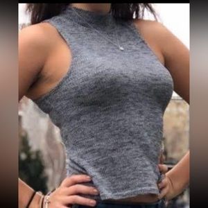 Women’s sleeveless mock neck sweater.